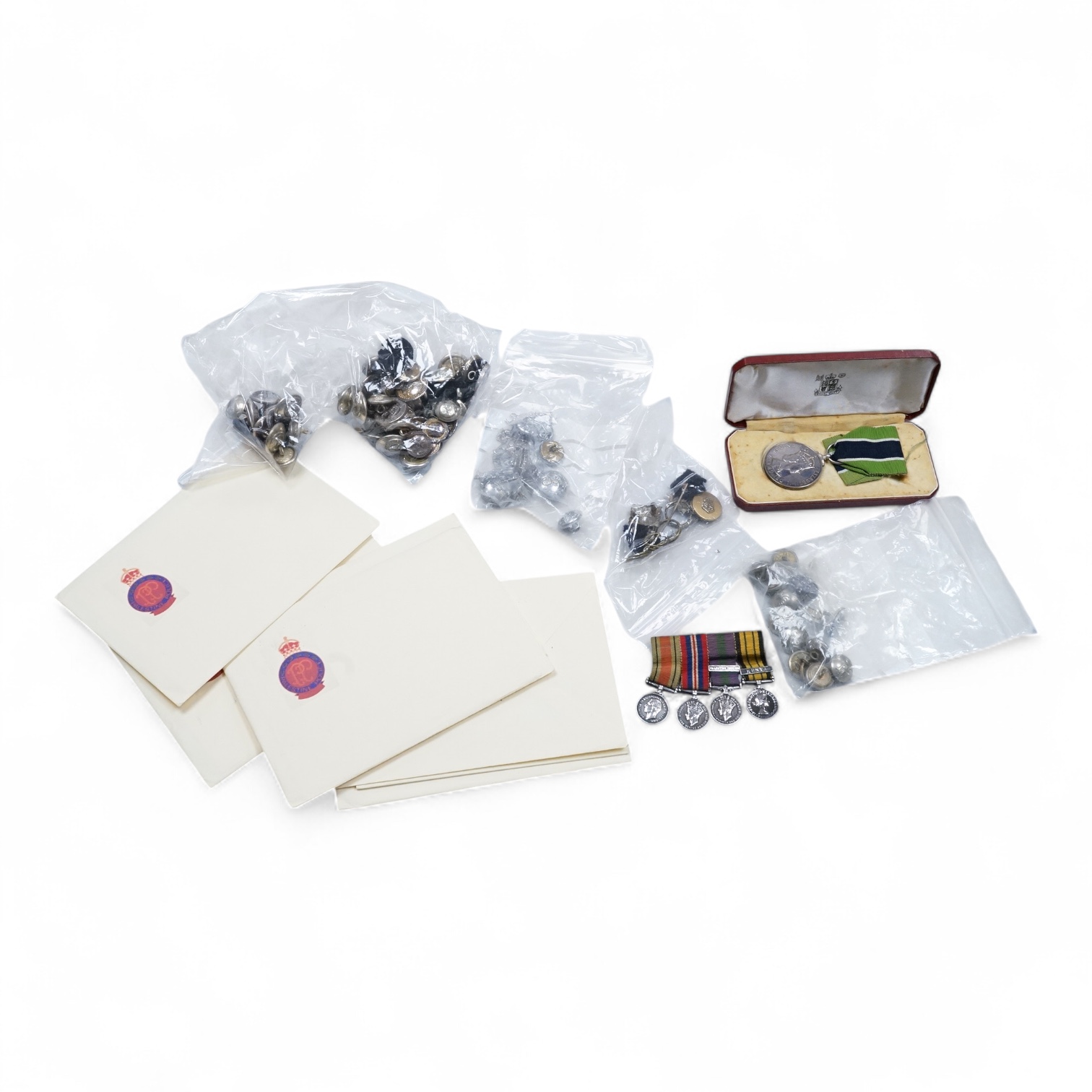 A cased ERII Colonial Police Force Medal for Meritorious Service awarded to John F. Brown, Asst. Supt. Kenya Police., together with a WWII miniature medal set including a General Service Medal with a clasp for Palestine